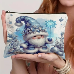 Detail of Christmas gnome pouch showing linen texture and blue elf print in hand