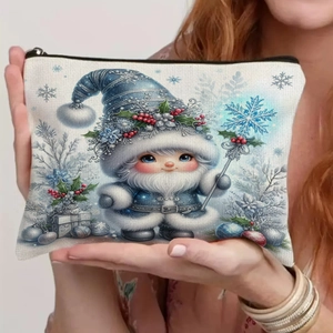 Blue Christmas gnome canvas makeup pouch with festive zipper closure held in hands