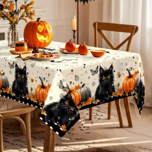 Halloween tablecloth featuring black cat, pumpkins, and autumn leaves with checkered border
