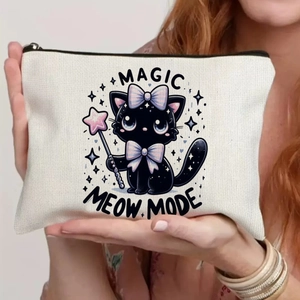 Canvas makeup bag with magic cat print and meow mode text held by a model