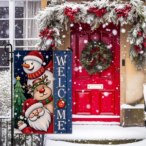 Vertical Welcome Christmas garden flag featuring Santa and reindeer in a snowy yard setting