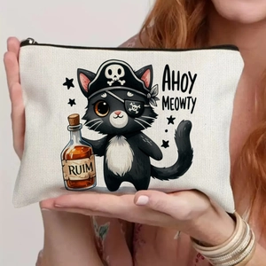 Detail of white canvas pouch with pirate cat illustration and black zipper closure