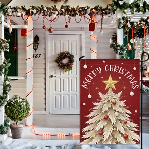 Outdoor Christmas garden flag with gold tree on red background in a festive yard setting