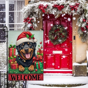 Christmas garden flag featuring a Rottweiler with Santa hat on a snowy outdoor background