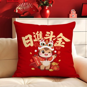 Detail of red festive square cushion with cartoon ox and New Year decorations