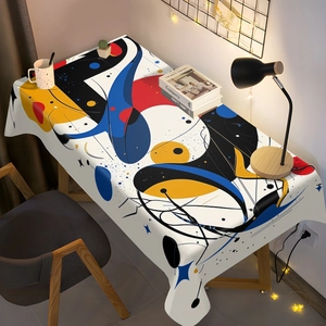 Détail de nappe abstraite style Miro avec motifs géométriques sur un tissu de qualité