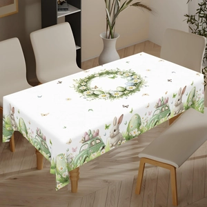 Close-up of Easter tablecloth featuring bunnies, colorful eggs, and daisy patterns