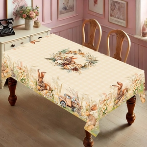 Detail of Easter tablecloth showing festive rabbit and colorful egg patterns on gingham base