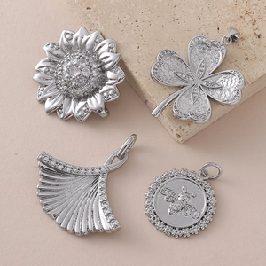 Silver plated DIY charms set featuring flower, clover, ginkgo leaf and bee pendant