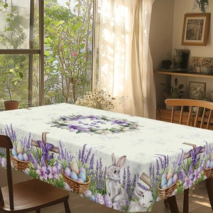Easter tablecloth featuring a wooden cross, purple lavender, and rabbits with He is risen text
