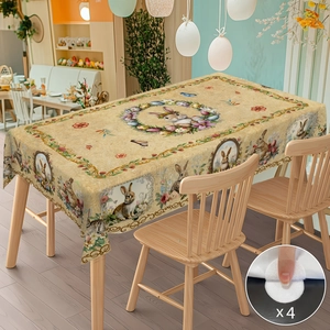 Detailed view of Easter tablecloth showing hand-drawn rabbit patterns and 4 non-slip pads