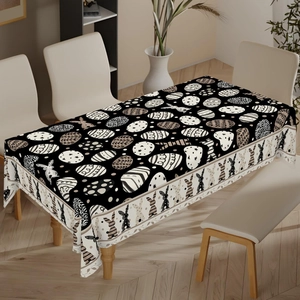 Detailed view of Easter tablecloth with bunny and colorful eggs patterns for festive dining