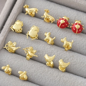 Gold-plated stud earring set with animal designs like ladybugs, bees, and cupid motifs