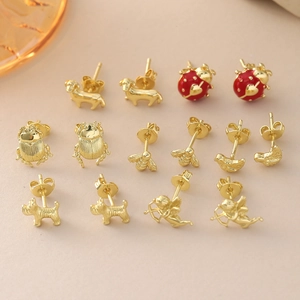 Collection of gold-plated animal stud earrings featuring ladybug, bee, and cupid.