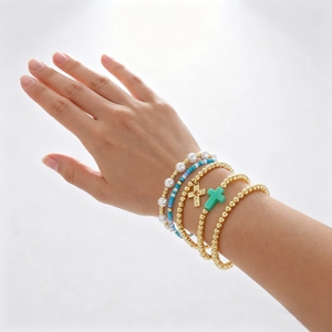 Cross pendant layered bracelet set with white pearls and blue beads in 18K gold plating