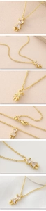 Detail der 18K vergoldeten Halskette mit Zirkon-Mädchen-Anhänger und verstellbarer Kette