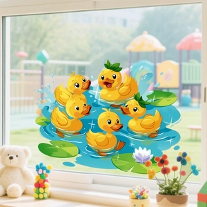 Detail view of cartoon yellow duck window stickers on glass with green lotus leaves and water