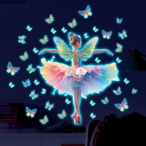 Detail of neon glow butterfly fairy wall decals in a dark bedroom setting