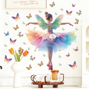 Detailed view of luminous butterfly girl wall stickers in a cozy bedroom setting