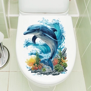 Self-adhesive toilet lid sticker with vibrant blue dolphin jumping out of ocean waves
