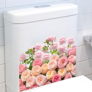 Detail of waterproof pink and apricot rose flower cluster stickers on a white toilet tank