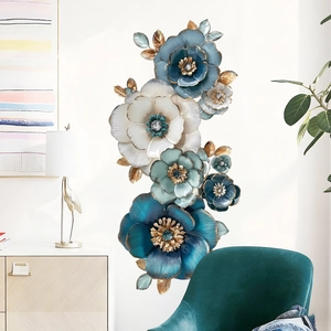 Vertical blue metal flower wall decor with gold edges and crystals for living room