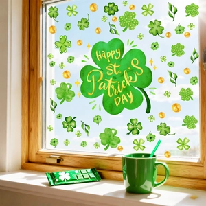 Vibrant St. Patrick's Day clover window clings set on glass with sunlight reflection