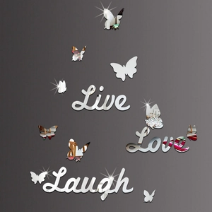 Macro detail of Live Love Laugh acrylic mirror wall stickers with butterfly accents
