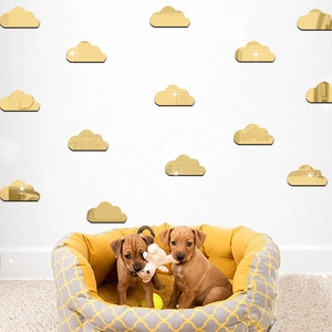 Set of decorative gold acrylic mirror wall stickers in cute cloud shapes for nursery decor