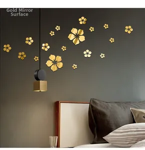 Detailed view of 3D golden mirror flower wall decals in a modern bedroom setting