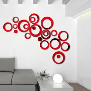 Detailed view of red 3D acrylic mirror wall stickers in a modern living room setting