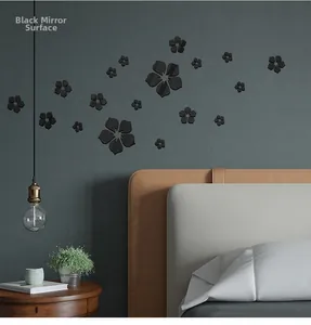 Detailed view of black mirror surface 3D acrylic flower wall decals in a modern bedroom