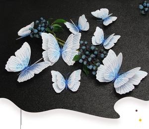 Detailed 3D double-layer butterfly wall decor with blue glitter texture on white PVC wings