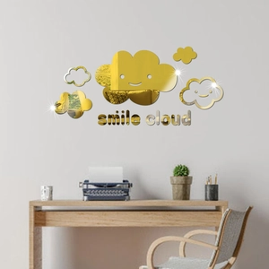 Macro detail of 3D gold acrylic mirror wall stickers with smiling clouds and smile text