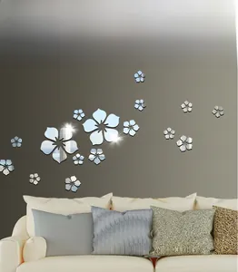 Detailed view of silver 3D acrylic mirror cherry blossom wall stickers in a modern living room