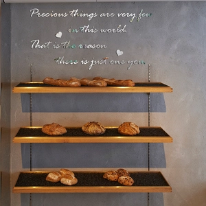 Macro view of mirror-effect acrylic wall decal with precious quote and 3D heart details