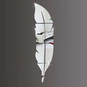 Detailed close-up of acrylic feather mirror wall stickers with reflective bedroom scene