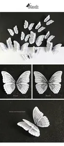 Detail view showing front and back of 3D black butterfly wall stickers with folded wings