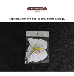 Detailed view of 12-piece 3D glitter butterfly wall stickers in clear OPP packaging