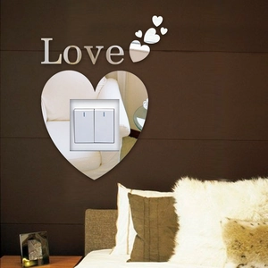 3D acrylic mirror light switch decal with heart shapes and Love lettering on bedroom wall