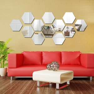 Set of 12 hexagonal acrylic mirror wall stickers in honeycomb layout on yellow brick wall