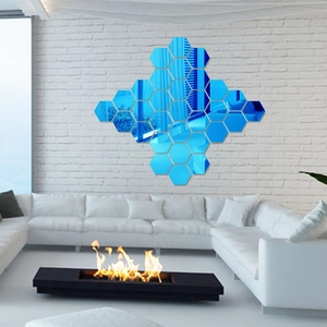 Modern wall decor featuring blue hexagonal acrylic mirror stickers in a honeycomb pattern