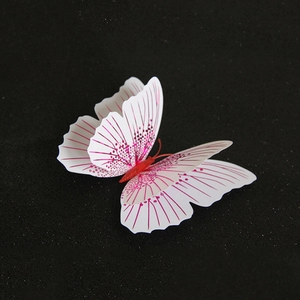 3D butterfly wall decor with dual-layer pink and white wings on a black background
