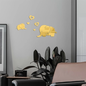 Detailed view of golden acrylic elephant mirror wall stickers with heart shapes