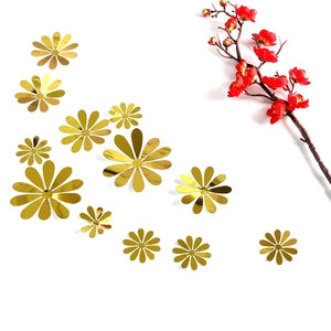 Detailed view of assorted golden mirror sunflower wall stickers with reflective finish