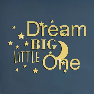 Macro detail of golden Dream Big acrylic mirror wall stickers with stars and moon