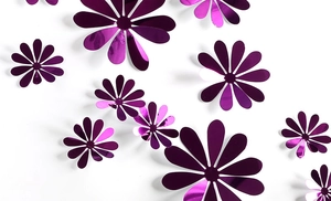 Macro shot of purple 3D mirror flower wall decals in various sizes on white background