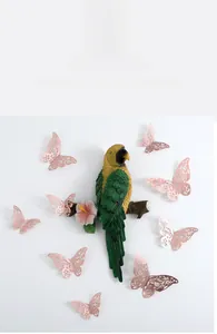 Vibrant parrot wall decor on floral branch with pink hollow metal butterfly stickers