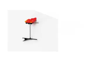 Detailed view of a realistic red butterfly spring hair clip with a black alligator grip