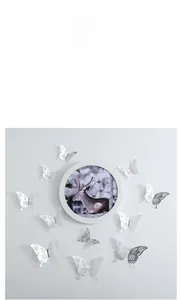 Detail showing 3D hollow butterfly wall stickers with intricate rose carving and silver texture